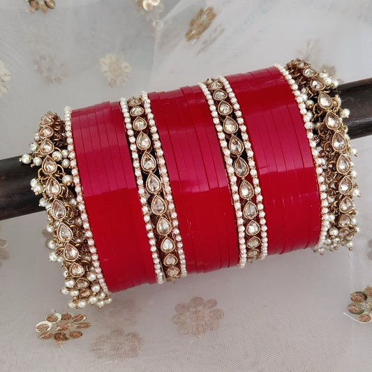 Elegance in Detail: Handmade Fine Red Bridal Chooda with White Bangles and Leaf-Shaped Diamonds