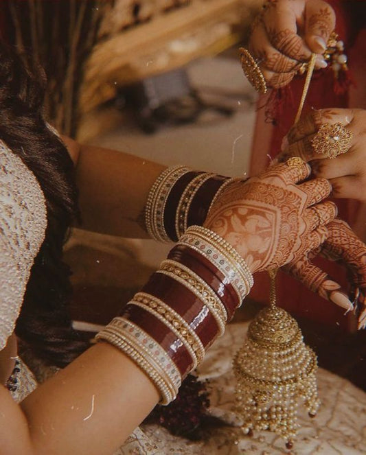 Elegant Maroon Bliss: Bridal Chooda for a Timeless Wedding Look
